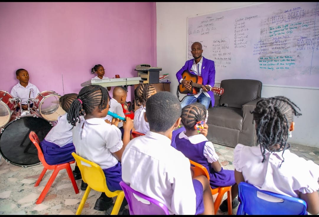 Teacher explaining a lesson on the whiteboard at Ambassadors Bilingual School