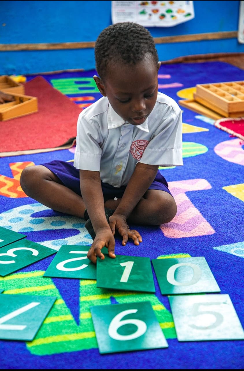 Pupils in Montessori classroom working independently at Ambassadors Bilingual School