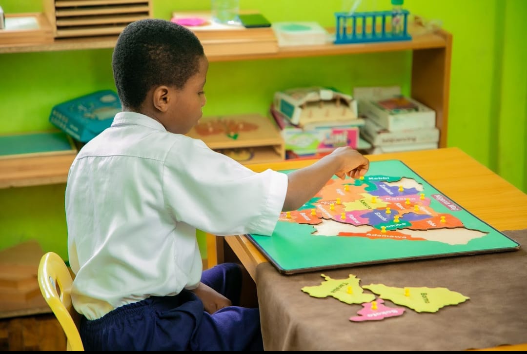 Children learning with Montessori number materials in a Montessori classroom at Ambassadors Bilingual School