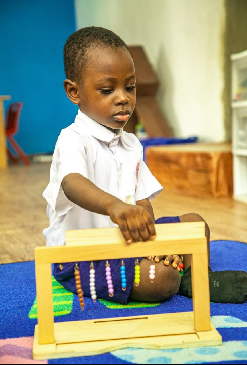 Children learning with Montessori number materials in a Montessori classroom at Ambassadors Bilingual School